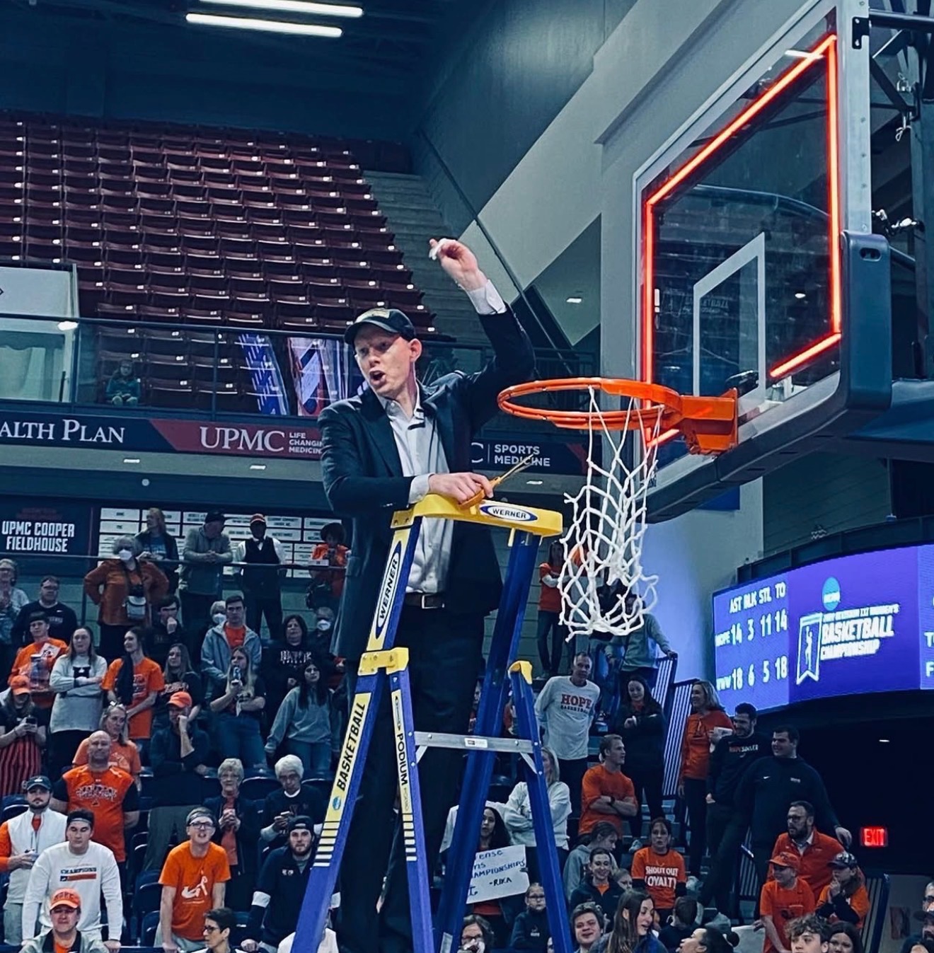 Austin cutting down the net after championship victory